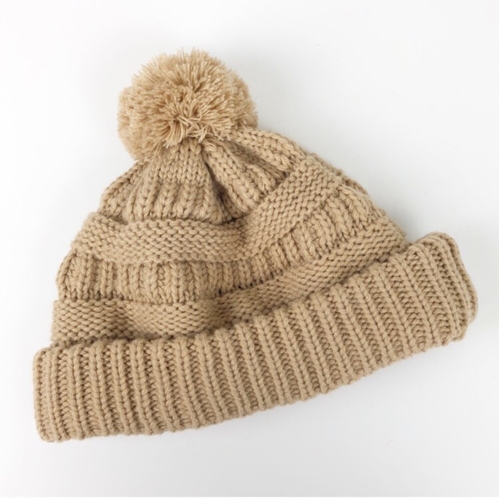 Tan knit pom pom beanie